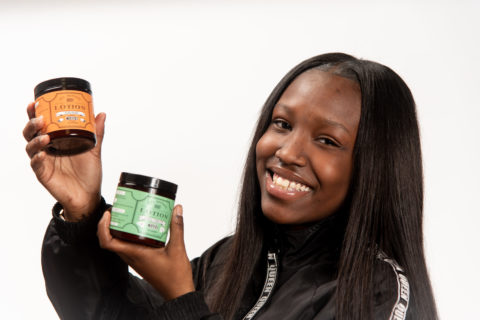 Student Holding Lotions